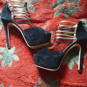 Black stilettos with gold straps